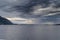 Heavy clouds and distant rain on fjord, Molde, Norway