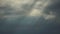 Heavy clouds and sunbeams over sea. gloomy seascape and heavy clouds, horizon, skyline