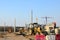 Heavy construction equipment and earthmoving excavators working on a construction site in the city.