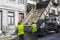 Heavy construction truck dumping sand at building site