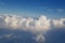 Heavy cumulonimbus white clouds floats in the blue sky