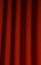 Heavy dark red pleated felt curtain background