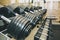 Heavy dumbbells lying in the raw in the gym. Fitness sport motivation. Happy healthy lifestyle living. Exercises with bars weights