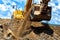 Heavy duty construction excavator moving earth