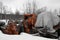 Heavy duty orange cement mixer in scrap yard