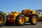 Heavy-duty trucks warehouse at autoworks. Giant mining dump trucks manufacture by the heavy vehicle plant.