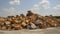 Heavy equipment at the construction zone pile up a lot of sand and boulders