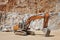 Heavy excavator on a quarry. Excavation machinery. Earthmover work