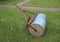 Heavy gardening lawn roller with rusty pull