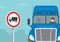Heavy goods vehicles driving tips. Close-up view of a blue semi-trailer driver and traffic or road sign.