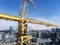 Heavy high tower crane view at skyscraper conctruction site. Industrial building background