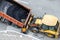 Heavy industrial dump truck unloading hot asphalt .City road construction and renewal site