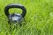 Heavy iron kettlebell in grass