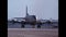 Heavy-lift cargo aircraft taxiing slowly on the runway frontal view