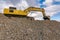 Heavy machinery for stone transport and gravel transformation for construction of a road