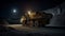 Heavy mining dump truck during night loading of rock in limestone quarry, stands on background of unsharp mine excavator