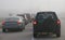 Heavy morning traffic negotiating foggy conditions