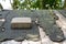 Heavy paving stone seen laid on an old shed roof.