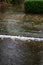 Heavy rain caused flooding over sidewalk, grass strip, and road