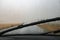 Heavy rain. Cloudburst on windshield. Windscreen wiper