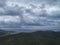 Heavy rain clouds above gulf and dirt roads. aerial view