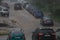 heavy rain flooding parked cars along the road at summer day in Tula, Russia