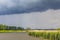 Heavy rain storm clouds wind waves water Oste river Germany