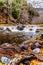 After heavy rainfall, water from Oak Creek flooding the road crossing Oak Creek at Orchard Canyon between Sedona and Flagstaff