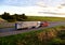 Heavy Recovery Truck Tows a Semitrailer truck on highway. Emergency Rescue Wrecker Tow Truck coach haul car along road. Towing