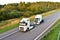 Heavy Recovery Truck Tows a Semitrailer truck on highway. Emergency Rescue Wrecker Tow Truck coach haul car along road. Towing