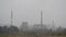 Heavy smog from industry. Heavy industrial and traffic air pollution in town. Factory chimney blowing pollution.