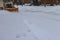 After heavy snowstorm, snowstorm snowplow trucks remove a snow from road at residential area