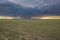 Heavy storm cloud over green prairie