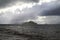 Heavy, storm clouds over the ocean, herald the arrival of a storm.