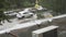 Heavy summer rain pours in the city. In the frame of a green big tree and cars. Autos drive through puddles at high speed spraying