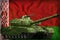 Heavy tank with pixel forest camouflage on the Belarus national flag background. 3d Illustration