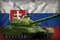Heavy tank with pixel forest camouflage on the Slovakia national flag background. 3d Illustration