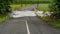 Heavy Tropical Rainfall Causes Flooding Over Creek Road