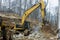 Heavy trucks with moving stone rock in a construction site on load gravel excavator