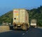 Heavy trucks run on 1A Highway in Nha Trang, Vietnam