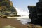 Heavy violent surf waves crashing on secluded black lava sand beach cove between rocks  - Cobquecura Piedra De La Loberia, Chile,