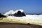 Heavy violent surf waves crashing on secluded black lava sand beach and rock with sea spray and foam  - Cobquecura Piedra De La