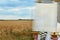 The Hebrew handwritten Torah scroll, on a synagogue alter wheat in period harvest on background cloudy sky