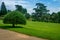 Hedge Topiary in a Peaceful Green Garden bushes and trees in formal english garden