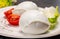 Ð¡heese collection, balls on soft white mozzarella bufala cheese served with green cos lettuce and tomato