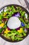 Ð¡heese collection, one big ball on soft white italian mozzarella bufala cheese with green rocket salad leaves and viola
