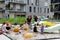 Heilbronn, Germany - August 12, 2019. Moms with young children play in the sandbox on the playground between modern buildings. The