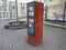 Heiligenhaus, Germany - December 2020: Selective focus of a Street box with books. Free public street library. Rusty bookcase