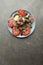 Heirloom Tomato and burrata salad plated garnished with basil