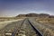 The Hejaz Railway under hazy blue skies in Wadi Rum desert